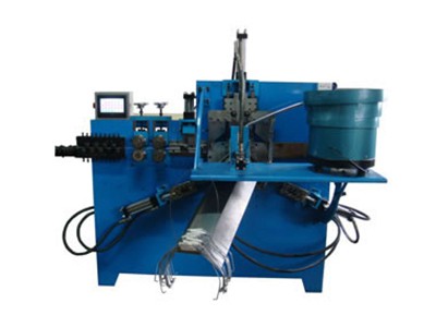 Machine de pliage pour anse de seau
